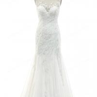 Designer wedding dress features illusion bateau neckline with delicate beadwork 7