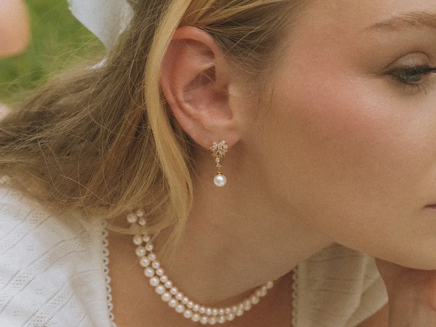 Round freshwater pearl earrings with diamond cluster