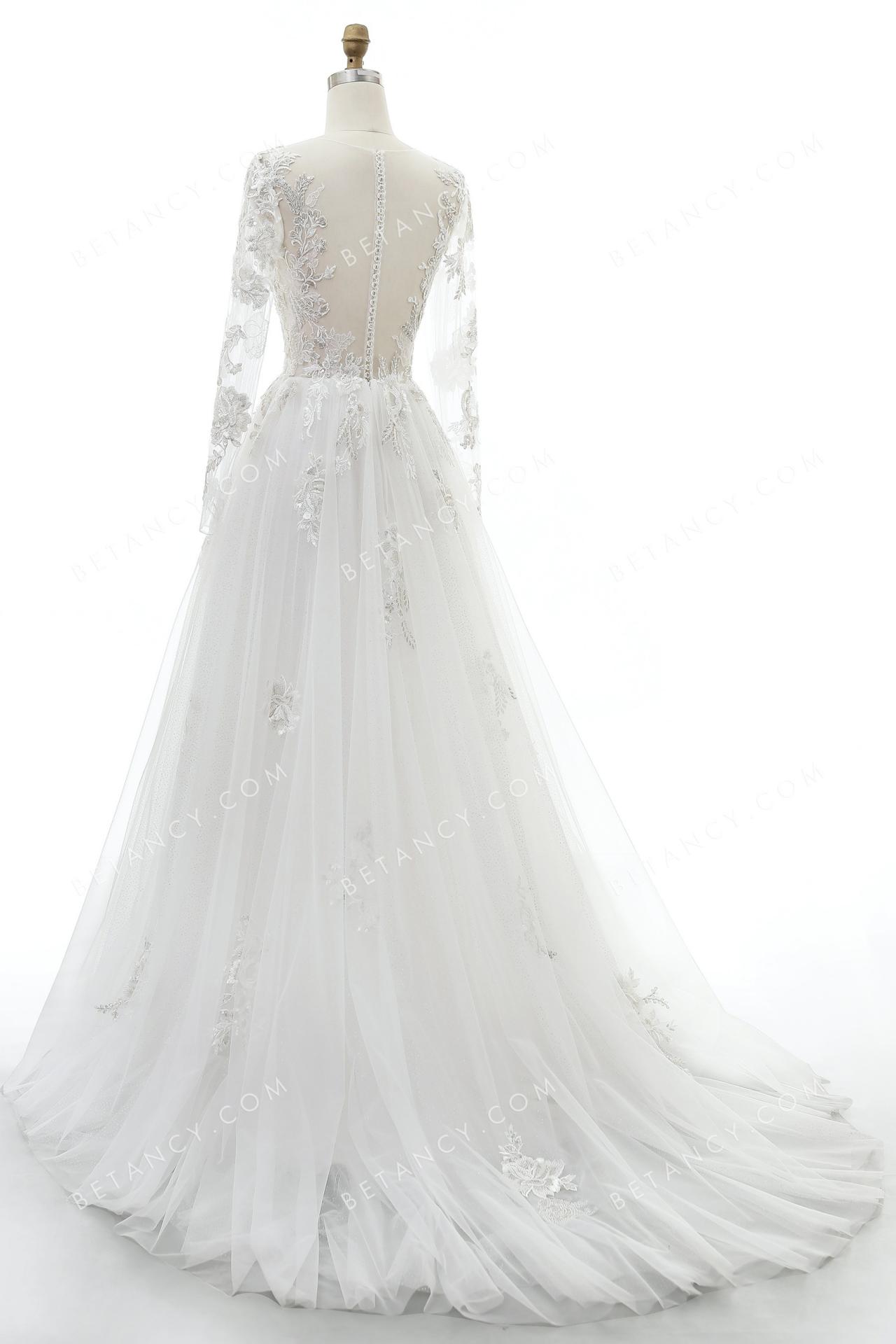 Sheer back with crystal button closure wedding dress 9