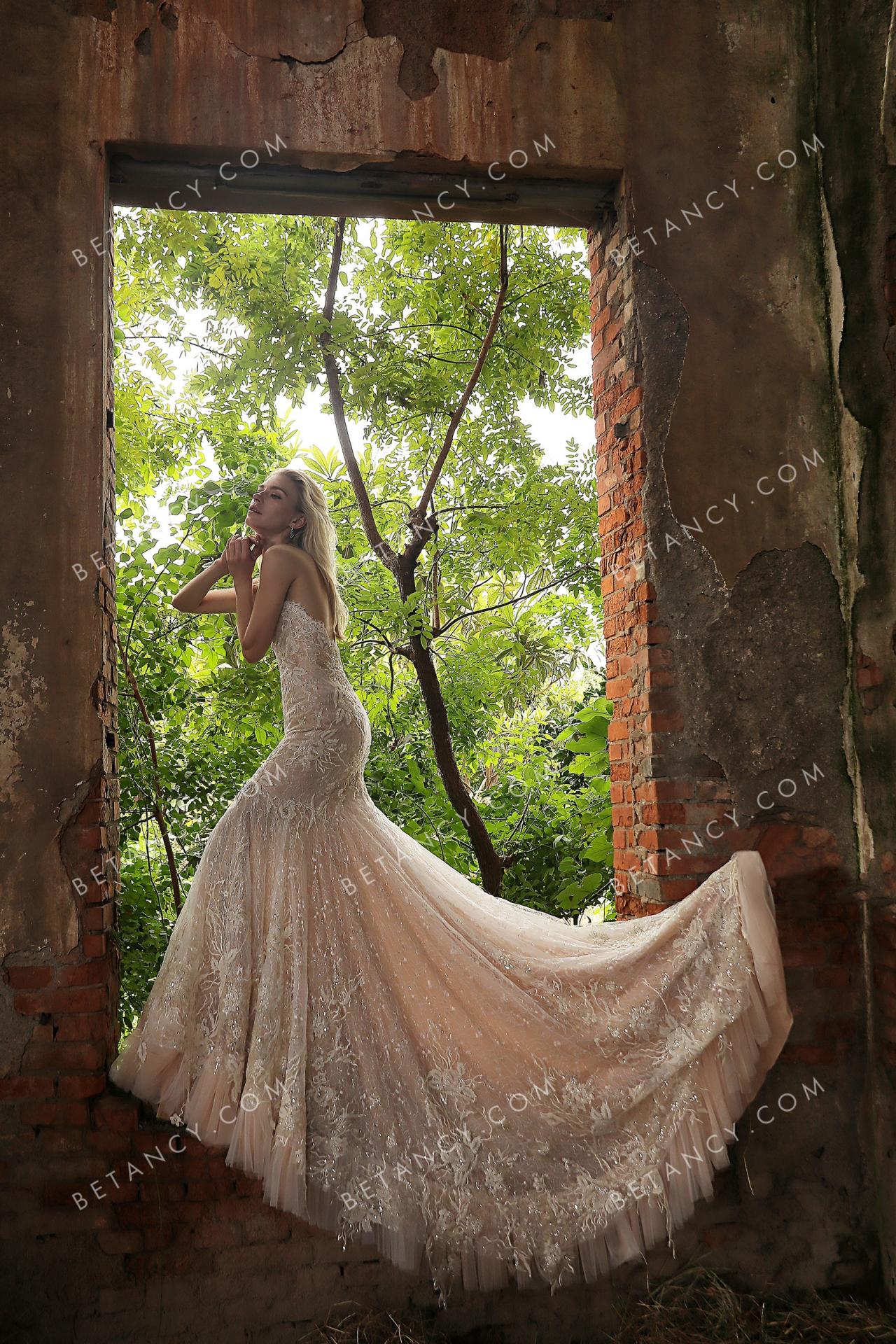 Shimmery beaded lace with dusty rose underneath bridal gown 6