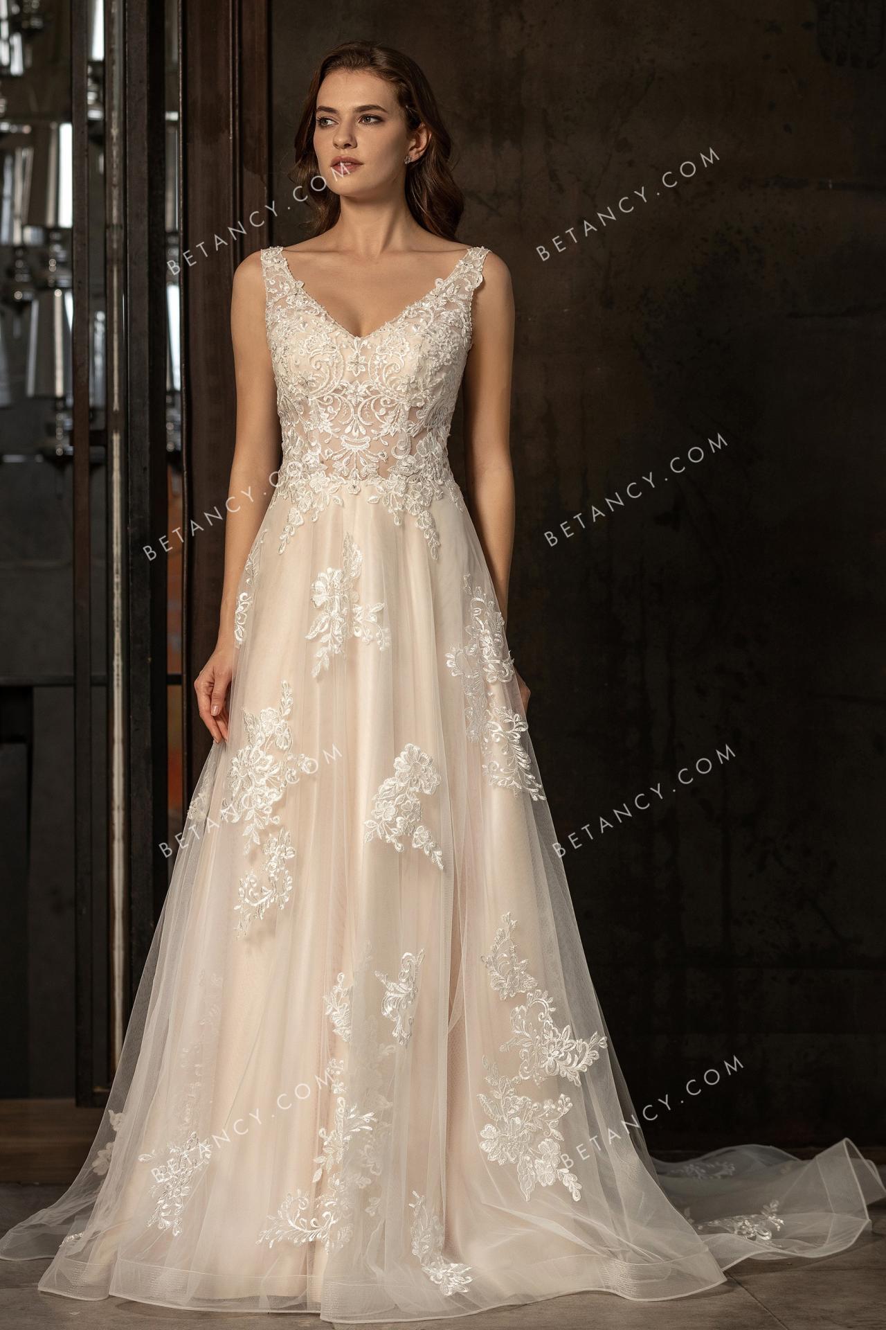 Sophisticated lace appliqued champagne bridal gown 1
