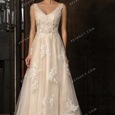Sophisticated lace appliqued champagne bridal gown 1